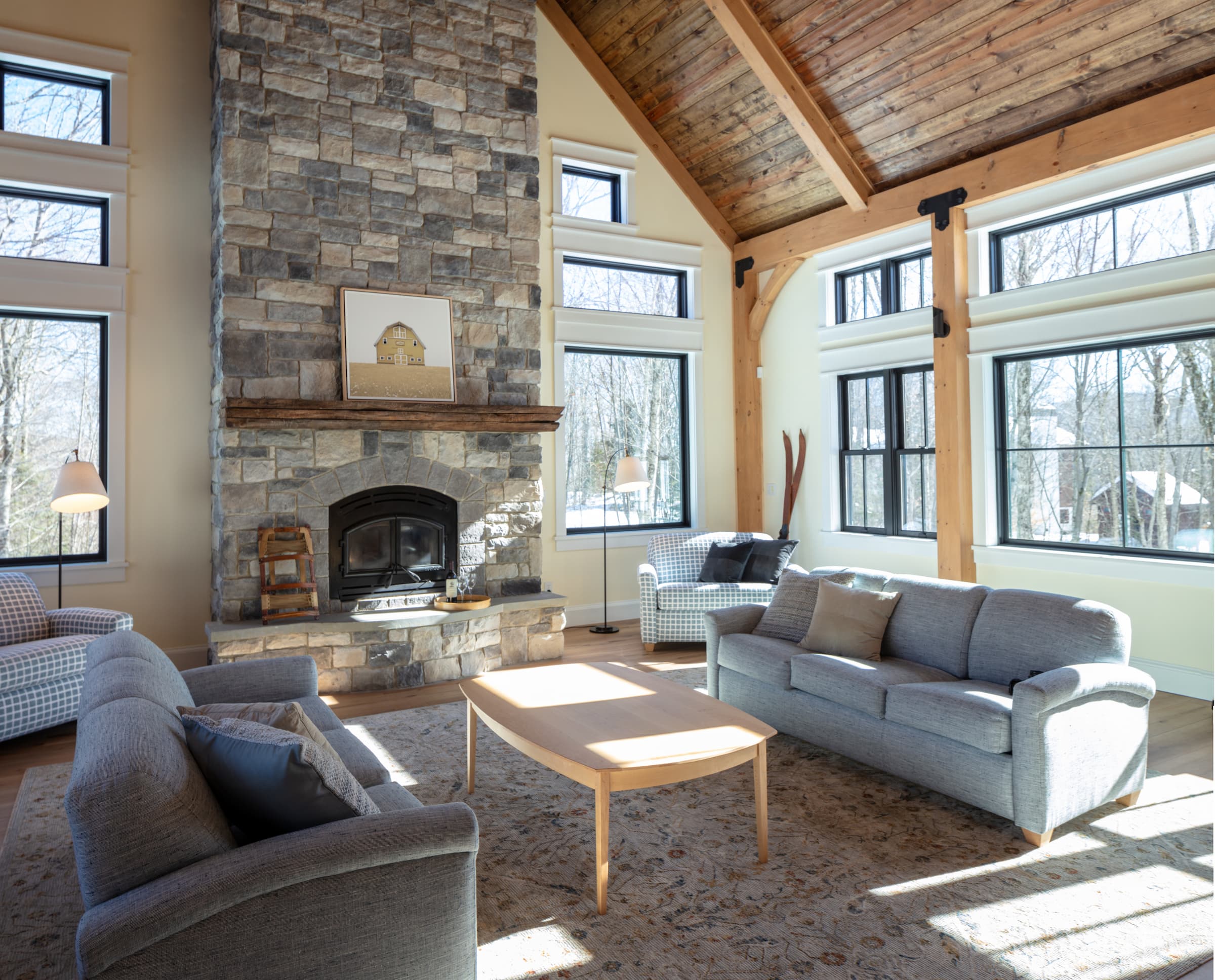 airy, comf, skihouse living room with huge fireplace and soaring ceiling